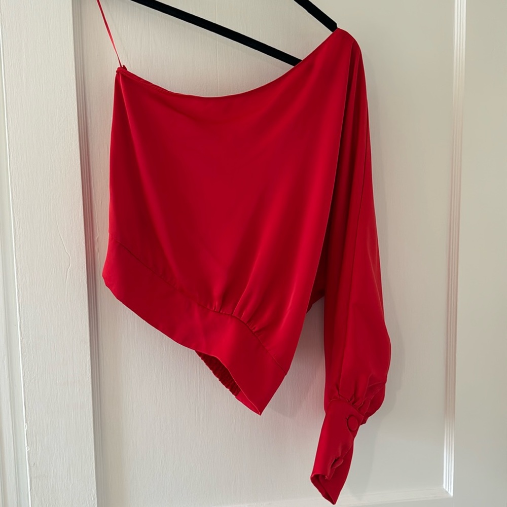 Red silky one shoulder top with exaggerated sleeve